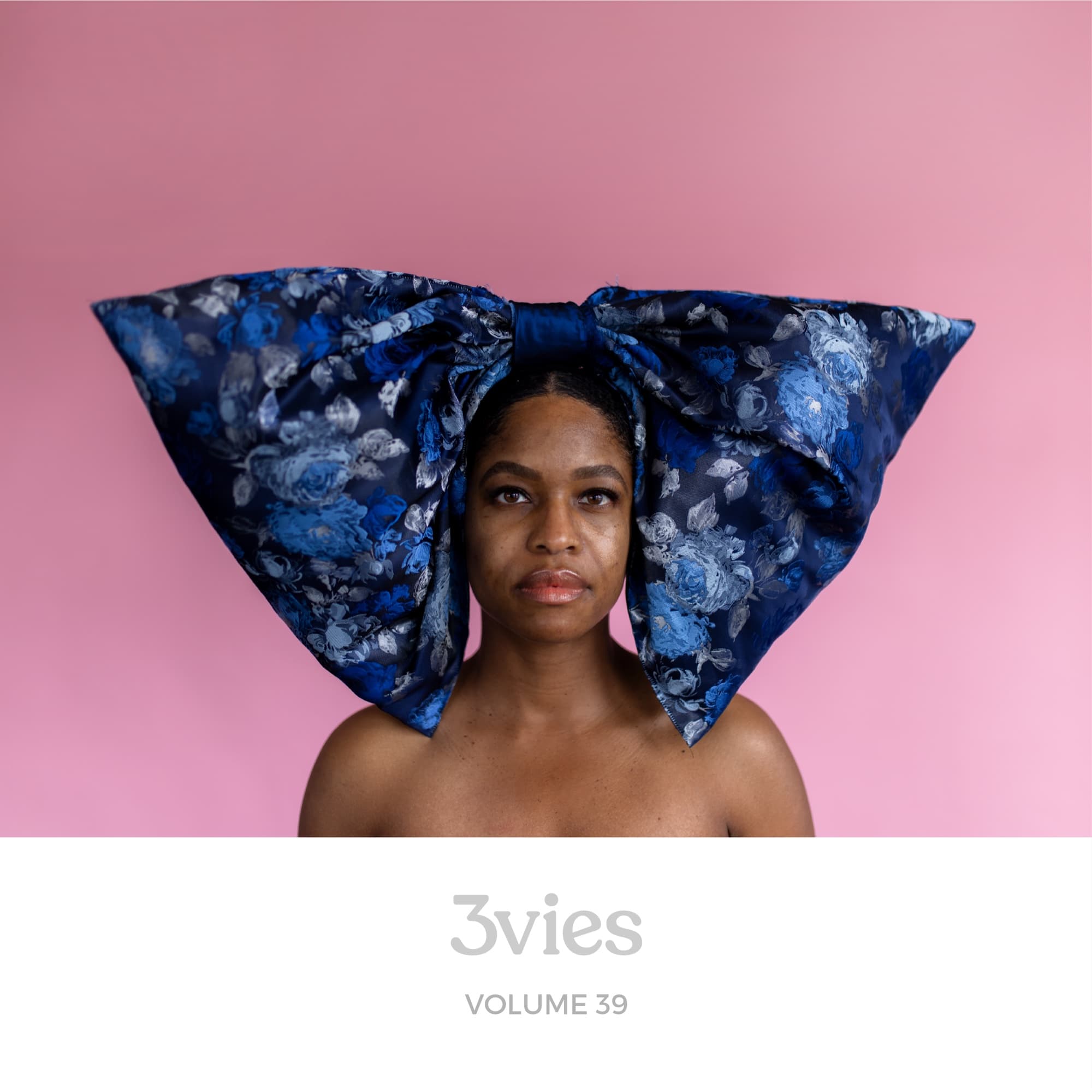Spotify playlist cover for 3vies Volume 39, featuring the cover portrait of a woman in a blue floral bow on pink.