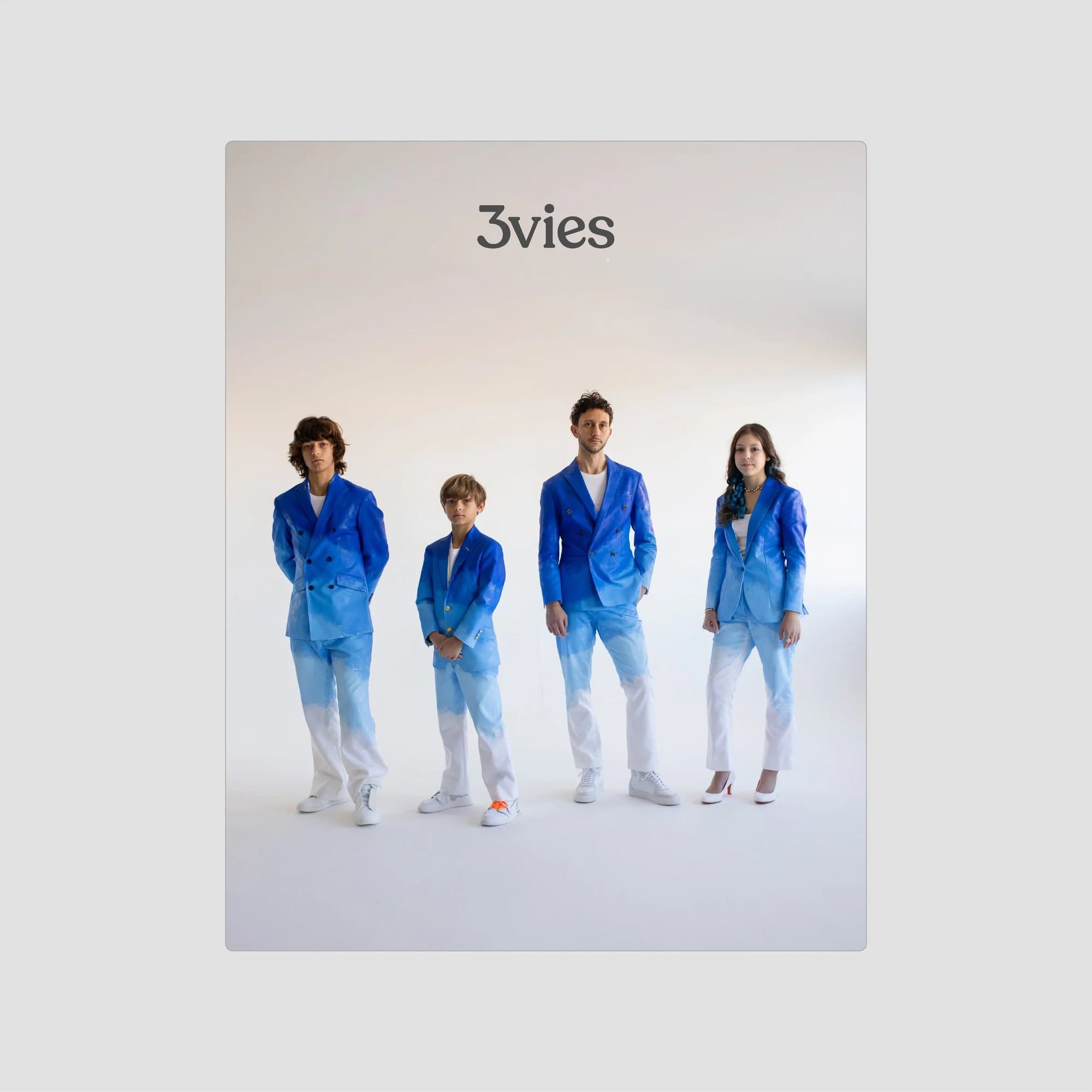 Cover of 3vies magazine Volume 40, To The Future: four people in hand-painted blue ombre suits.